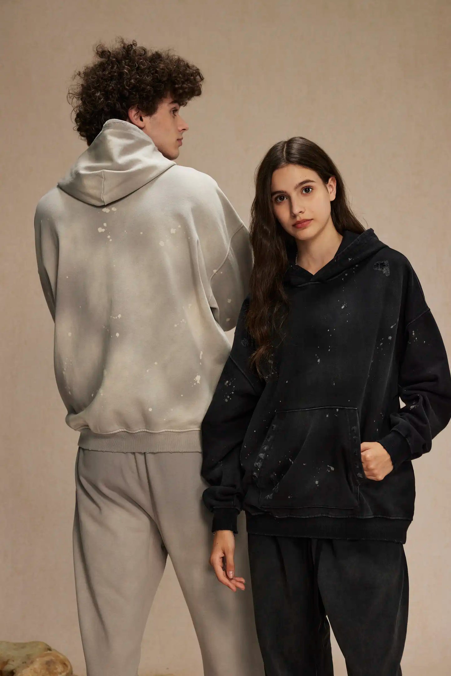 Spray-stained ink holes worn hoodie