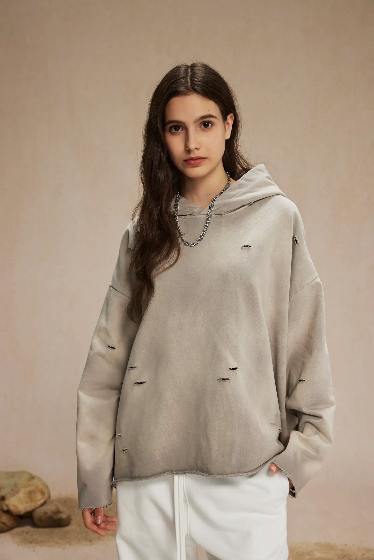 Irregular holes in the raw edge of the old wash water spray monkey hair hoodie