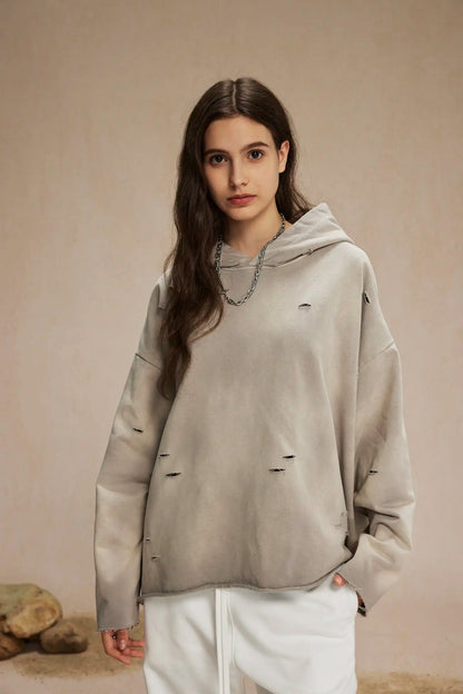 Irregular holes in the raw edge of the old wash water spray monkey hair hoodie