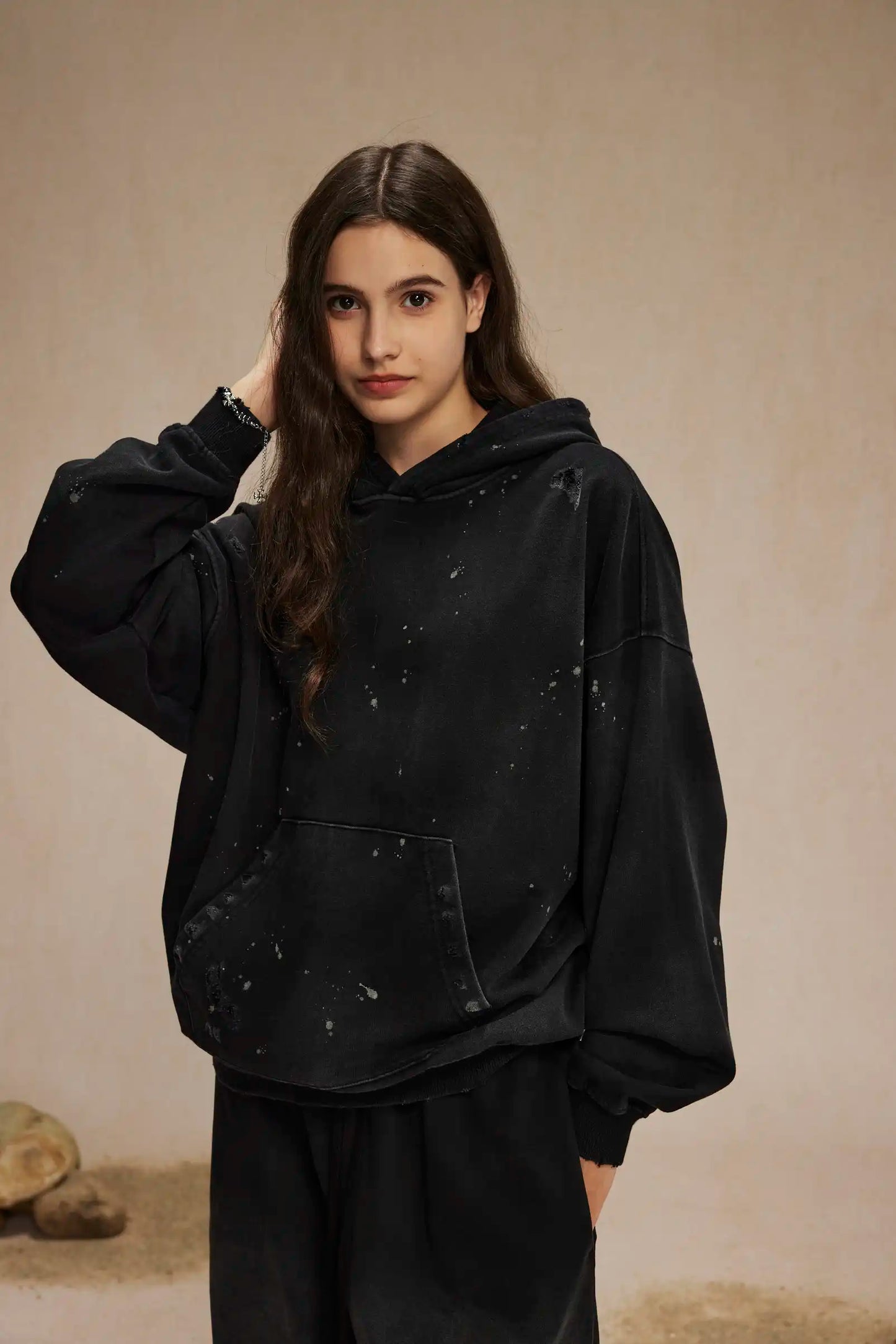 Spray-stained ink holes worn hoodie