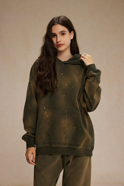 Spray-stained ink holes worn hoodie