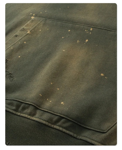 Spray-stained ink holes worn hoodie