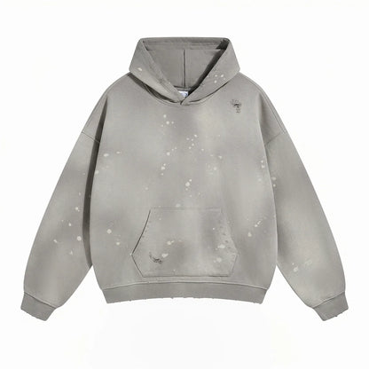 Spray-stained ink holes worn hoodie