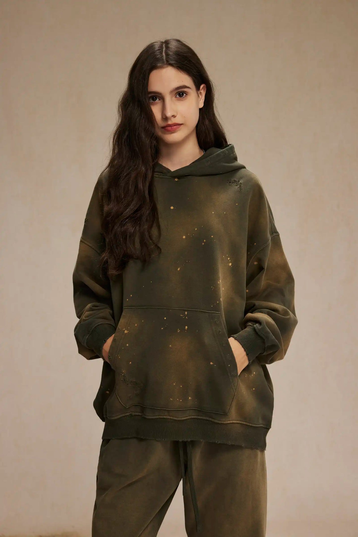 Spray-stained ink holes worn hoodie