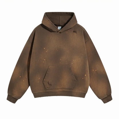 Spray-stained ink holes worn hoodie