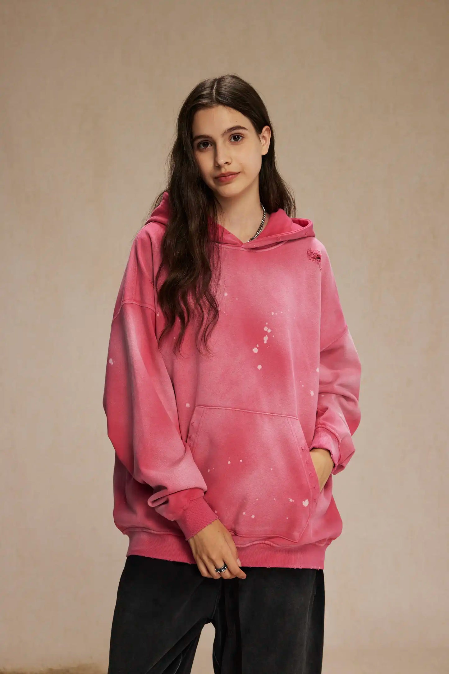 Spray-stained ink holes worn hoodie